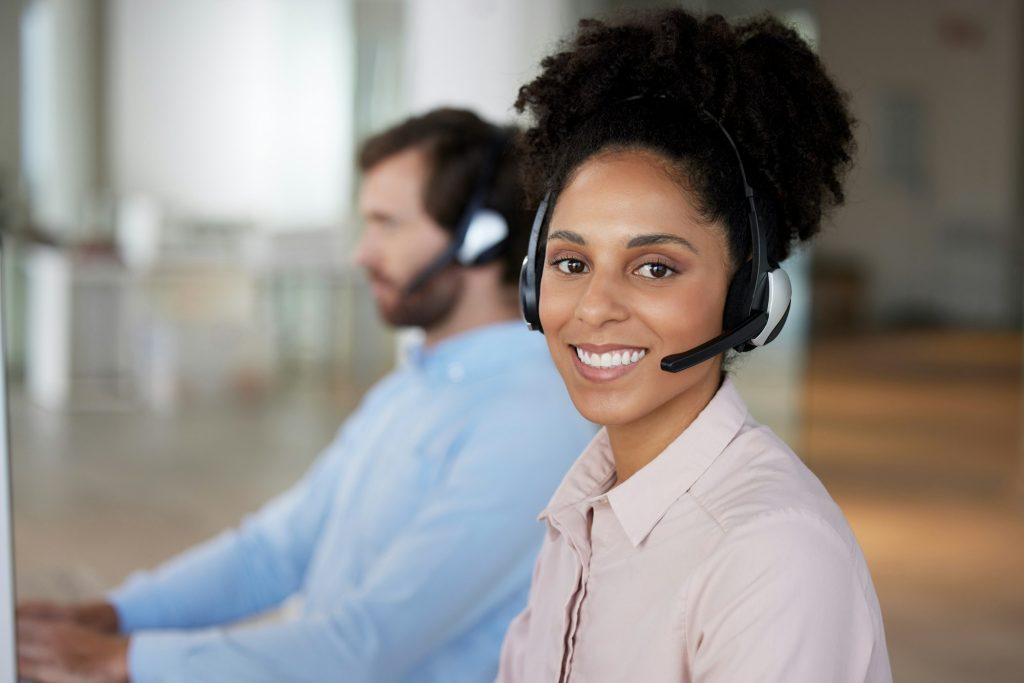 Smile, customer support and portrait of woman at call center for b2b connection, contact us and con
